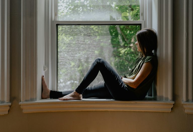 simple approach to mindfulness — person sitting quietly by window